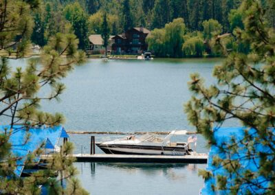 sun bathers on bow of docked cabin cruiser