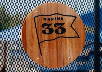 wooden Marina 33 sign on gate